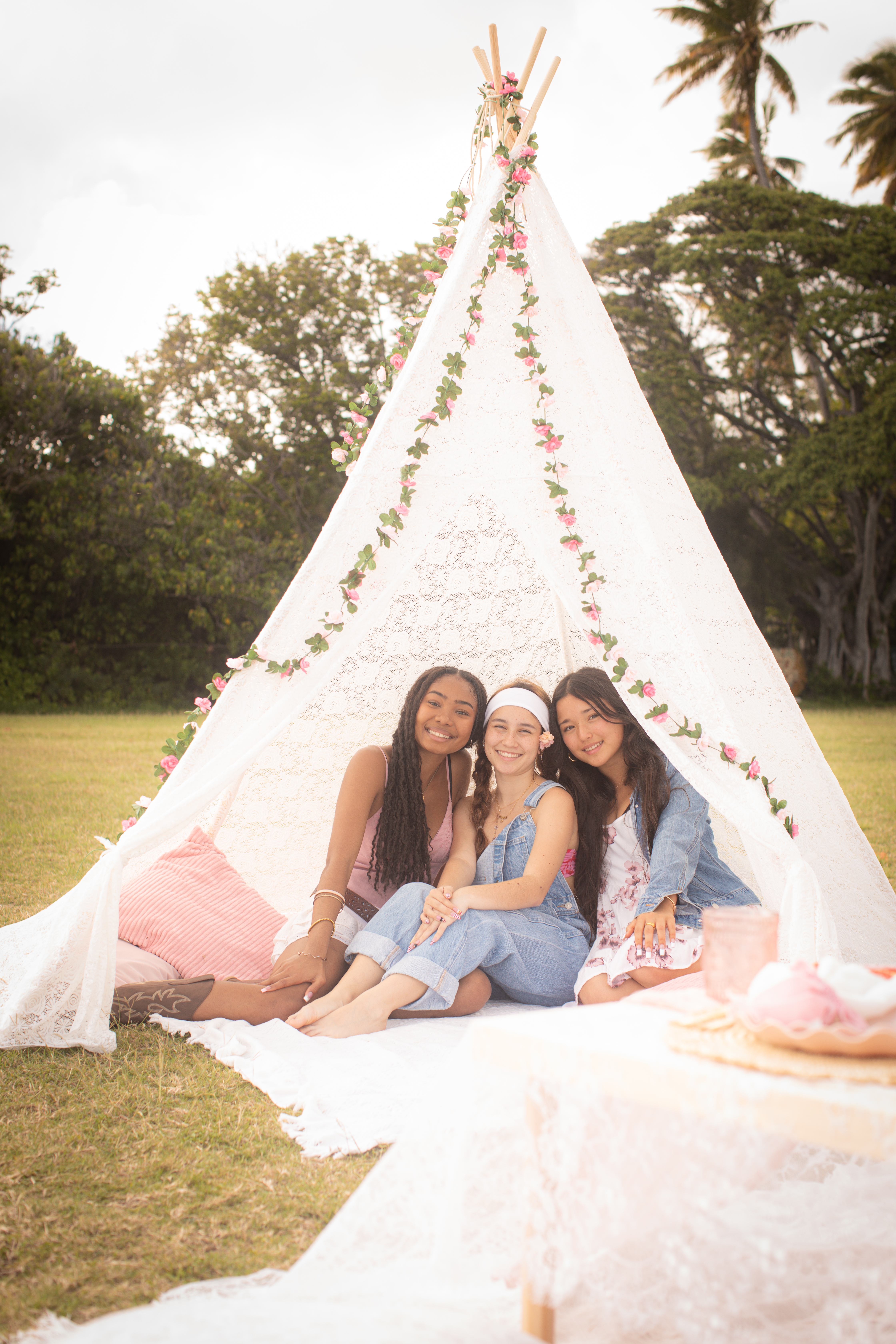 Teepee picnic setup with palm trees